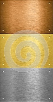 Aluminum and brass metal plates with rivets photo