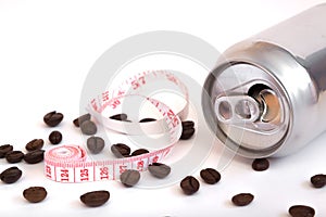 aluminum can and coffee beans on white background, body measurement tape, drinks concept with coffee for weight loss