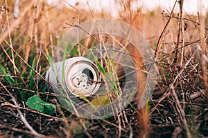 An aluminum can of drink in a forest