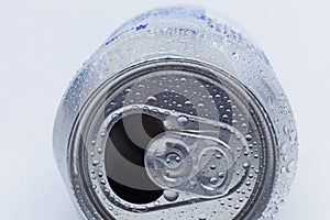 Aluminum can lying down with water drops