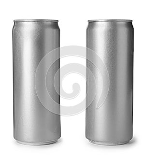 Aluminum cans with beverage on white background.