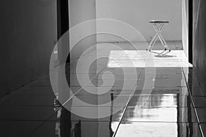 Aluminum chairs in black and white with harsh shadows. Loneliness and the concept of alienation