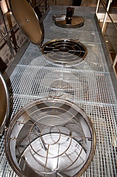 Aluminum containers for maturing wine in a winery