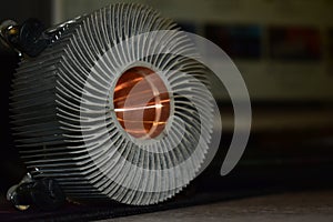 Aluminum cooler from the computer processor on the table.