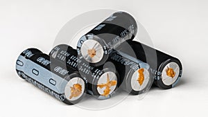 Aluminum electrolytic capacitors with failure from disuse on a white background