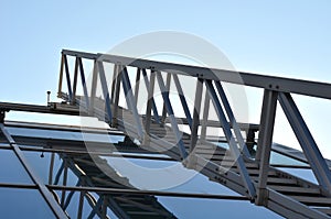 aluminum footbridge for washing windows above the skylight. simplifying