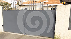 Aluminum grey high door steel dark gray metal gate of house street portal of suburb home