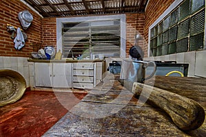 Aluminum mug and knife in an old farm kitchen photo