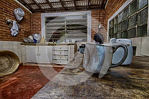 Aluminum mug in an old farm kitchen photo