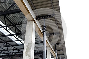 Aluminum roof with windows on a metal frame. Iron columns support the visor. Construction of the hangar
