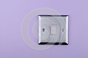 Aluminum switch plate on wall