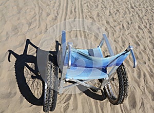 aluminum wheelchair on the sand