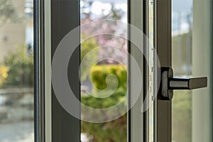 Aluminum window open detail. Metal door frame closeup view