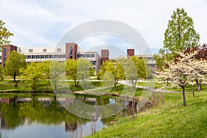 Alumni Hall is reflected in a pond on the campus of Southern Illinois University.