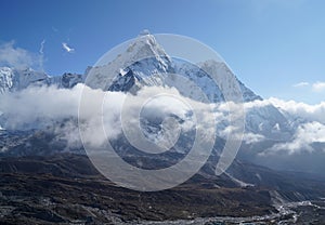 Ama Dablam 6814m clouds covered peak View near Dingboche settlement in Sagarmatha National Park, Nepal. Everest Base Camp EBC
