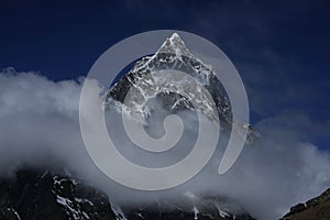 Ama Dablam in the clouds in Himalayas