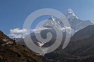 Ama Dablam is a mountain in the Himalaya range of eastern Nepal. The main peak is 6,812 metres, the lower western peak is 6,170