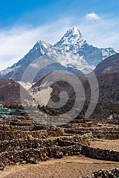 Ama Dablam mountain peak behind Pangboche village in Everest base camp trekking route. Himalaya mountains range in Nepal