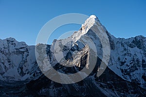 Ama Dablam mountain peak, famous peak in Everest base camp trekking route view from Chukung village, Himalaya mountains range in