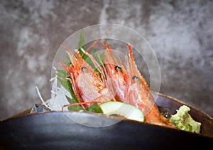 AMAEBI, sweet shrimp or spot prawns, served on ice with green tosaka nori and fresh wasabi shredded radish and green shiso leaf.