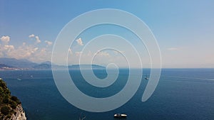 Amalfi coast and sailing boat, yachts in the mediterranean sea. Rocky cliffs