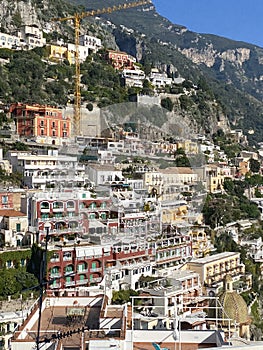 Amalfi Coast views of the homes built into the mountain cliffs in Positano, Italy