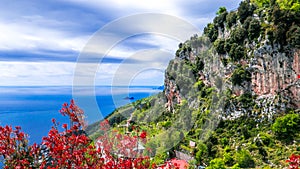 Amalfi Costline, Naples, Italy. Panoramic view of the Amalfi coastline, with vertical rocky cliffs and luxuriant vegetation.