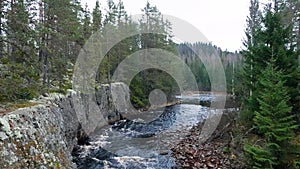 Aman river near Helvettesfallet, waterfall of Hell near Orsa in Dalarna in Sweden photo