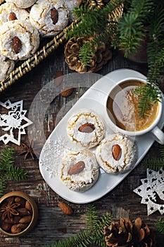 Amaretti Cookies. Gluten-free Italian Almond Cookies, cup of coffe and New Year decoration