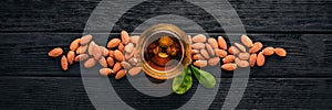 Amaretto Almond Liquor. Almond On a wooden background. Italian drink Top view.