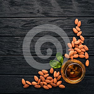 Amaretto Almond Liquor. Almond On a wooden background. Italian drink Top view.