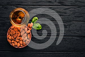 Amaretto Almond Liquor. Almond On a wooden background. Italian drink Top view.