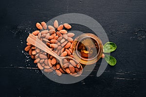 Amaretto Almond Liquor. Almond On a wooden background. Italian drink Top view.