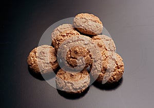 Amaretto cookies: typical Italian food on black background