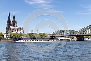 River cruise ship AMASTELLA passing Cologne Cathedral