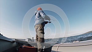 Amateur angler fishing on the lake