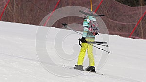 Amateur skier girl on a lift