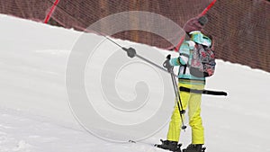 Amateur skier girl on a lift