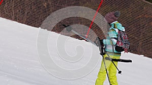 Amateur skier girl on a lift