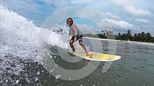 Amateur surfer rides the wave