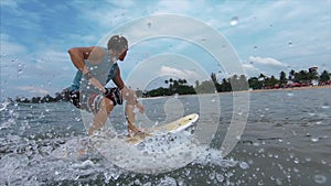 Amateur surfer rides the wave