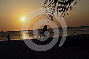 Amateurs playing football at Jumeira beach in Santa Marta, Colombia during sunset photo