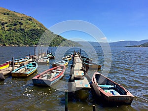 Amatitlan lake with boats offering tours in Guatemala photo