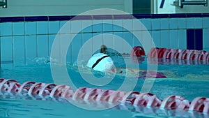 Amator Swimmer Practicing in Water Swimming pool.