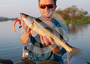 Amatuer angler holds fish