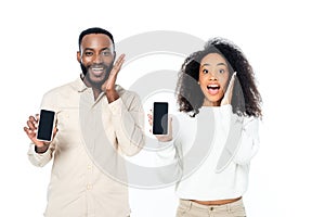 amazed african american couple showing mobile