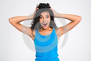 Amazed afro american woman looking at camera