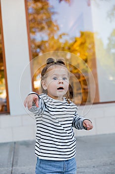 amazed baby girl in striped long