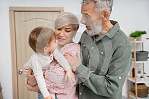 amazed bearded man looking at toddler