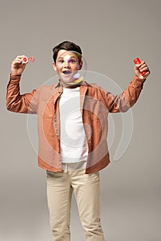 Amazed boy looking at soap bubble